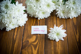 Fototapeta  - bouquet of white chrysanthemums on wooden table