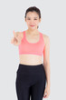 © NT_studio - Beautiful portrait young asian woman in sport clothes with satisfied and confident gesture finger v sign isolated on white background, asia girl have shape and wellness, exercise for fit with health.
