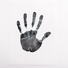 Top View Of Black Print Of Hand On Paper Isolated On White, Human Rights Concept