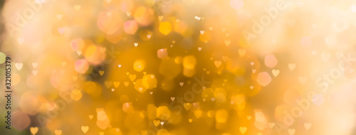 abstract-yellow-background-with-bokeh-lights-and-many-hearts-love-spring-summer-easter