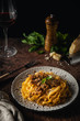 Italian pasta tagliatelle ragu bolognese on rustic dark background