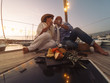 © Alessandro Biascioli - Senior couple toasting champagne on sailboat vacation - Happy mature people having fun celebrating wedding anniversary on boat trip - Love relationship and travel lifestyle concept