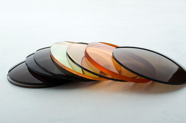 Closeup of different colored optical corrective lenses for eyewear