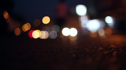 Wall Mural - Blurred bokeh traffic on the road at night in a big city.