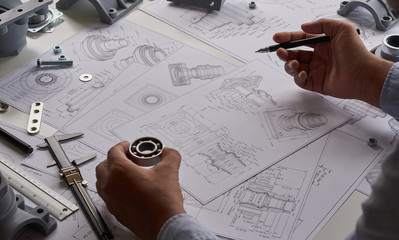 Poster - Engineer technician designing drawings mechanical parts engineering Engine.manufacturing factory Industry Industrial work project blueprints measuring bearings caliper tools