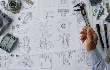 Poster - Engineer technician designing drawings mechanical parts engineering Engine.manufacturing factory Industry Industrial work project blueprints measuring bearings caliper tools