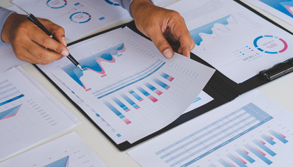 Poster - businessman working calculate data document graph chart report marketing research development planni