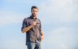 © be free - Feeling casual. male fashion style. looking very trendy. men beauty and sexuality. Real men. macho man unshaven face. businessman in glasses. confidence and charisma. sexy man sky background