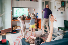 Family Dancing Together Indoor Playing Videogame