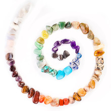 Spiral Made Of Colorful Semiprecious Gemstones Isolated On A White Background.