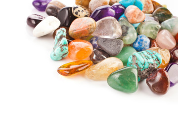  Colorful semiprecious gemstones isolated on a white background.