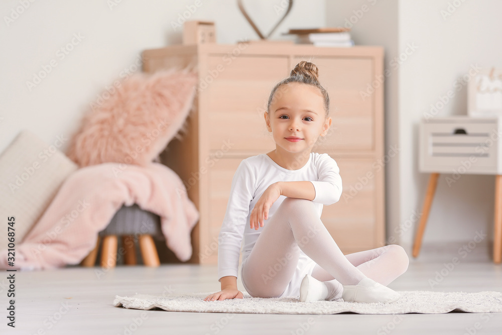 Cute little ballerina at home