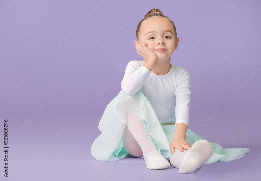 Cute little ballerina on color background