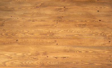 Surface of a highly grained brown wood panel