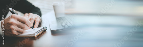 Fotomural Hands taking notes on notebook; panoramic banner