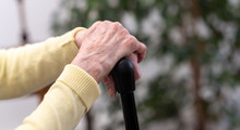 Old Woman Hands Holding A Cane