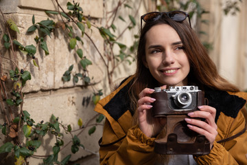 Photo of young tourist girl exploring streets of Baku. Moody photos of teenager girl visiting old city and taking photos of the city