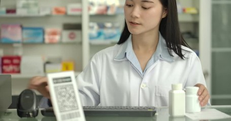 Customer using smartphone for scanning QR code for paying at drugstore. 4K QR code cashless payment concept.