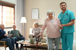 © New Africa - Medical worker taking care of elderly woman in geriatric hospice