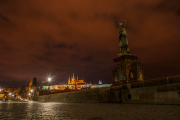 Wall Mural - Statue on Charles Bridge (Karluv Most) and St. Vita Cathedral at night, Prague