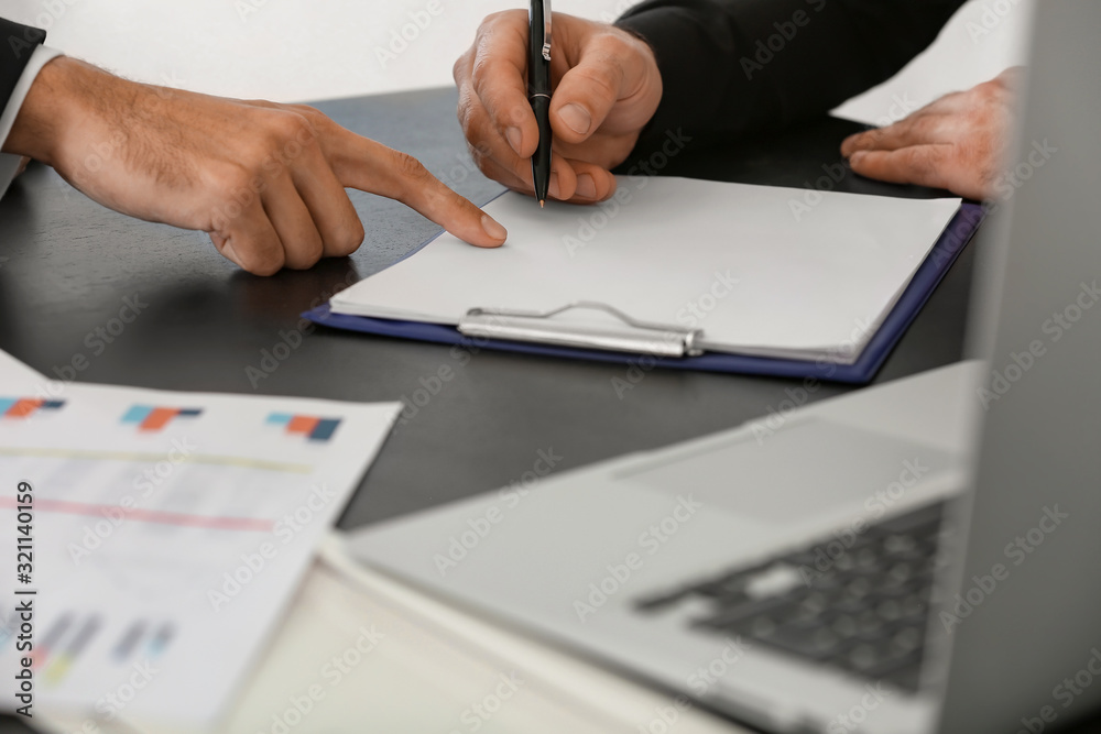 Bank manager working with client in office