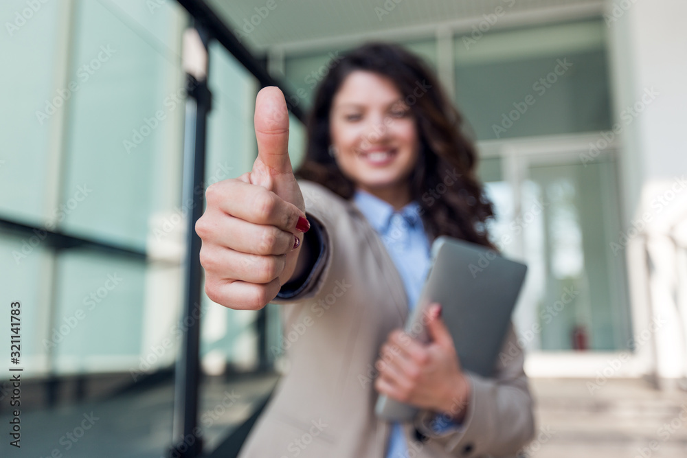 Beautiful smiling business woman showing thumbs up sign Stock Photo ...