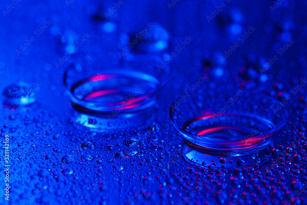 Contact lenses on color background