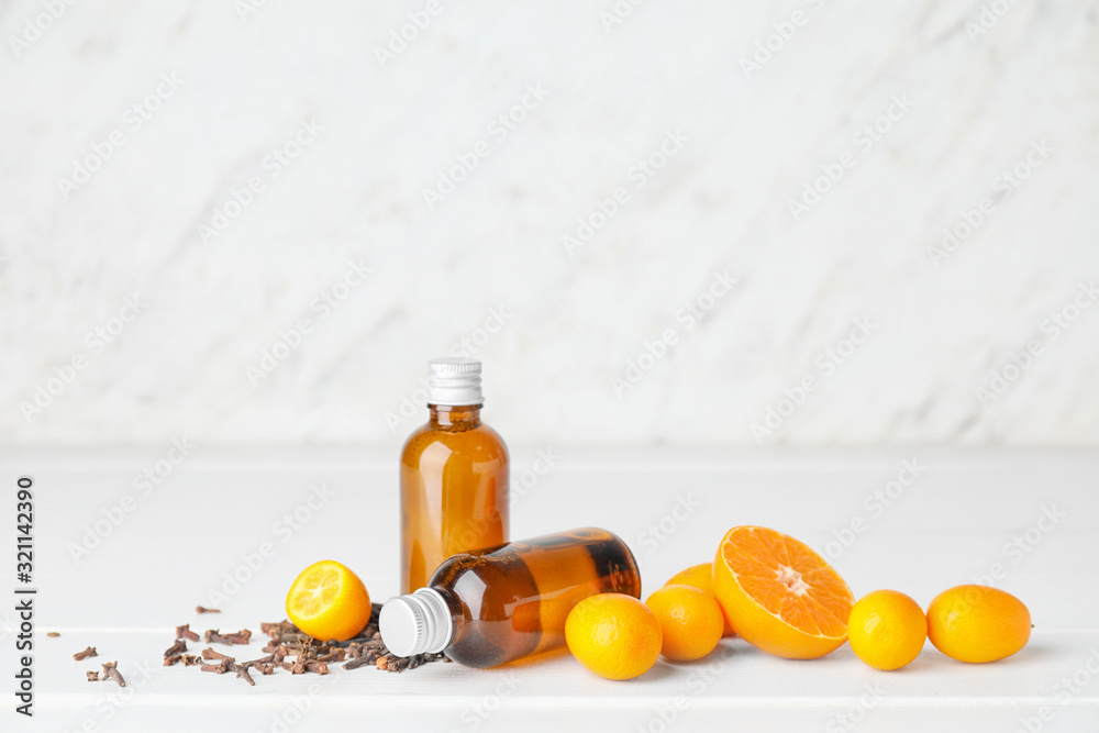 Cosmetic product in bottles on white table