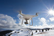 © Budimir Jevtic - Drone flying above mountain top in winter