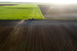 Aerial image of tractor working in field