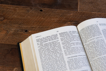 bible with a wood table