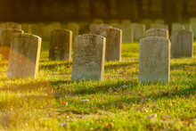 Tombstones In Warm Evening Light An Antietam National Cemetery In Sharpsburg, Maryland, USA - With Copy Space