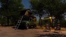 Static Timelapse Of Campsite At Night On Africa Safari, Wild Camping/glamping Under Moonlight Night Sky, With Truck, Tent And Solar Lights, Botswana, Central Kalahari Game Reserve.