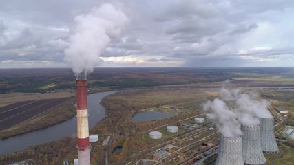 Wall Mural - State District Power Station generating heat and electricity. High pipes and cooling towers are visible. Aerial view.