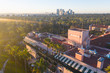 Stunning aerial view of Beverly Hills neighborhood, Beverly Hills Hotel, and Sunset Boulevard surrounded with palm trees in Los Angeles, California.