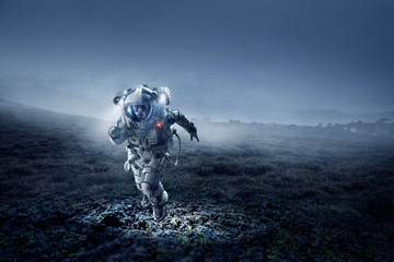 Wall Mural - Spaceman running fast. Mixed media