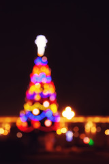 Wall Mural - Street city lights out of focus at night, bokeh, Christmas tree