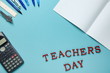 word teachers day on blue surface