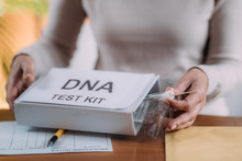 Senior Woman Doing A Mailed DNA Test At Home