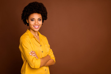 Wall Mural - Profile photo of beautiful funny business dark skin curly lady beaming smiling arms crossed good mood reliable worker wear yellow shirt isolated brown color background