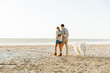 © Drobot Dean - Cheerful young couple walking at the beach