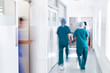 © Monkey Business - Motion Blur Shot Of Medical Staff Wearing Scrubs In Busy Hospital Corridor