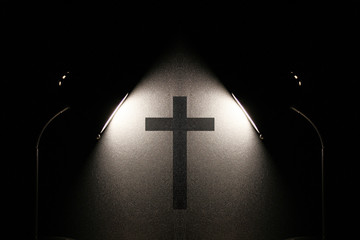 Lamps Shine on the silhouette of a Catholic cross on the wall. Religion.