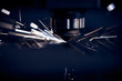 CNC Laser cutting of metal close up, modern industrial technology. Small depth of field