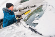 © Mikhail Ulyannikov - kid helps to clear the car of snow