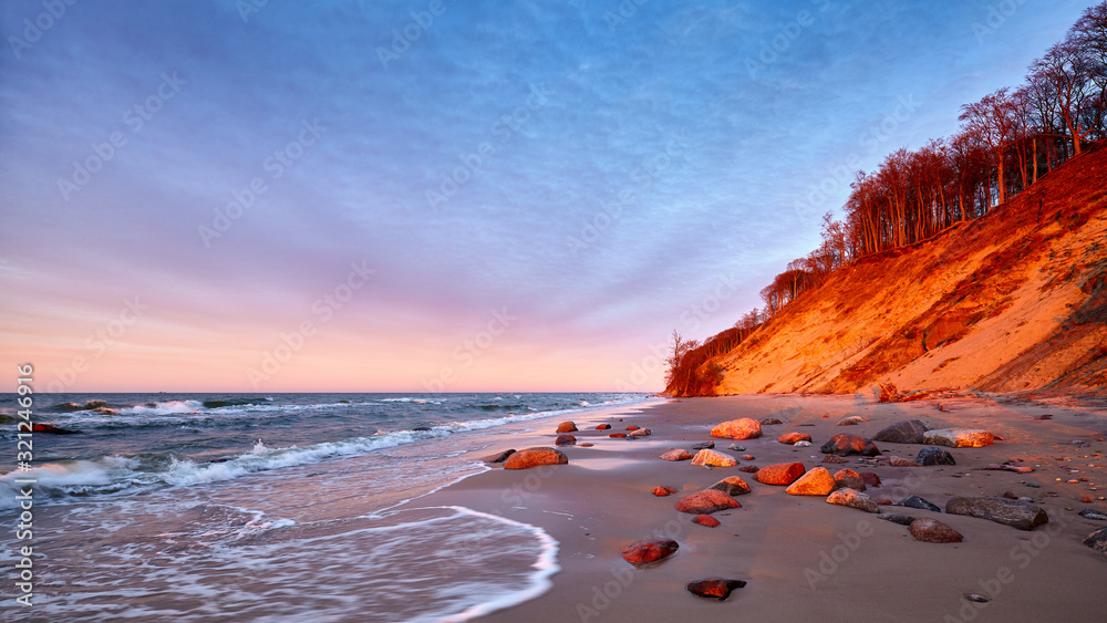 Cliff at a beach in Wolin National Park at sunset, Poland. - obrazy, fototapety, plakaty 