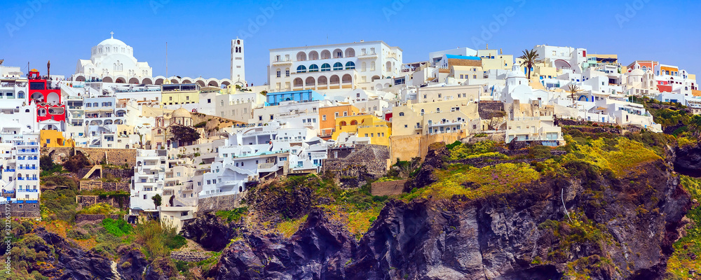 Fira or Thira, Santorini, Greece panoramic banner with white and blue colorful houses on high volcanic rocks - obrazy, fototapety, plakaty 