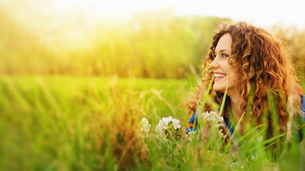 Pretty smiling girl relaxing outdoor