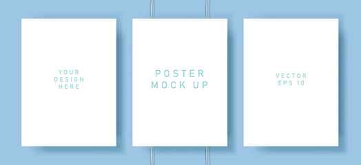 Poster - White blank poster with drop shadows hanging on wall. Empty paper sheet on binders, A4 page mockup. Vector illustration