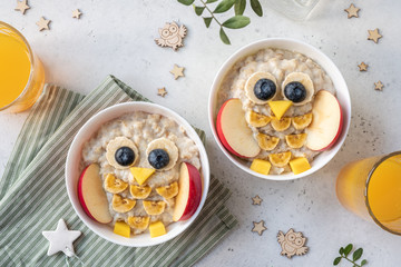 Wall Mural - Funny kids breakfast porridge look like cute owls
